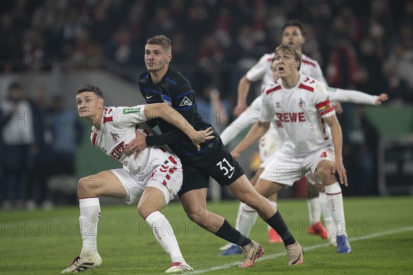 BEAUTIFUL SPORTS/ (DFL/DFB REGULATIONS PROHIBIT ANY USE OF PHOTOGRAPHS AS IMAGE SEQUENCES AND/OR QUASI-VIDEO) Cologne, RheinEnergieStadion, North Rhine-Westphalia, Eric Martel (1.FC Köln, midfield, #6), Marton Dardai (Hertha BSC, defence, #31), Timo Hübers (1.FC Köln, defence, #4), DFB-Pokal 1.FC Köln, Hertha BSC on 04.12.2024 at RheinEnergieStadion in Cologne Germany