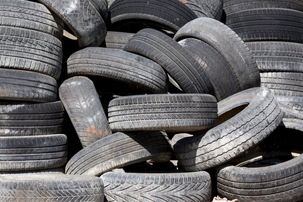 Old and used car tyres on a pile