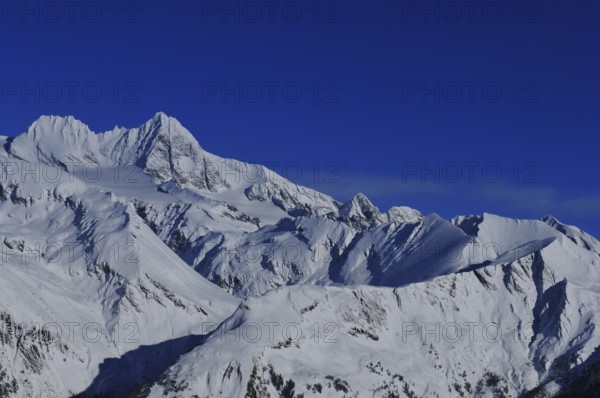 Panoramic mountain view of the Grossglockner Snow mountain range in East Tyrol from the Adler Lounge above Matrei