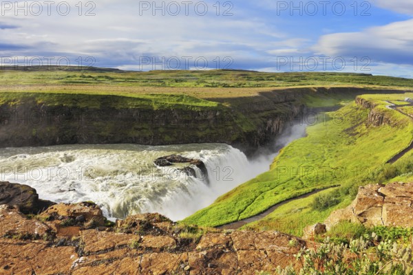 Enormous waterfall Gyullfoss. Water abyss. Summer in Iceland