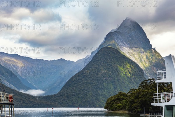 Port of tourist and pleasure boats of the Milford Sound fjord. The magical nature of the southern hemisphere. South Island, New Zealand. Fiordland park