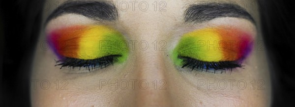 Eye-catching vivid makeup eye details of a young girl. homosexual flag makeup