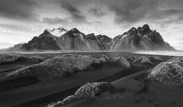 Black and white image of Icelandic Landscape Southern Iceland, Hofn, Stokksnes peninsula with the famous Vestrahorn Mountains and dramatic sky