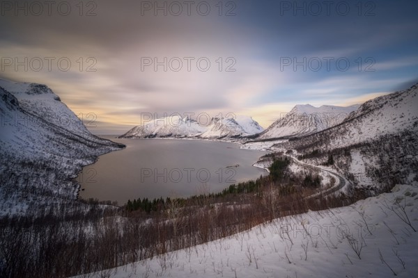 Beautiful winter landscape scene, sunset or sunrise in mountains and fjords