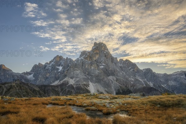 Cimon delle Pala mountain above Passo Rolle with white clouds
