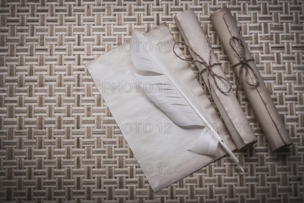 Rolls of vintage paper clean sheet quill on woven matting