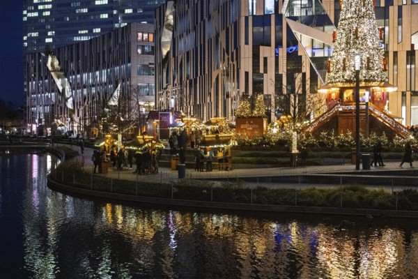 Decorated Christmas tree and Christmas market in front of the Kö-Bogen building at Corneliusplatz on Königsallee in Düsseldorf, North Rhine-Westphalia, Germany, 29 November 2024, Europe