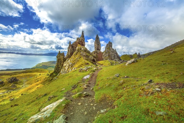 Old Man of Storr, large pinnacle of rock on top of a north hill in the isle of Skye, Highlands in Scotland, United Kingdom. The Old Man of Storr is one of the most photographed wonders in the world