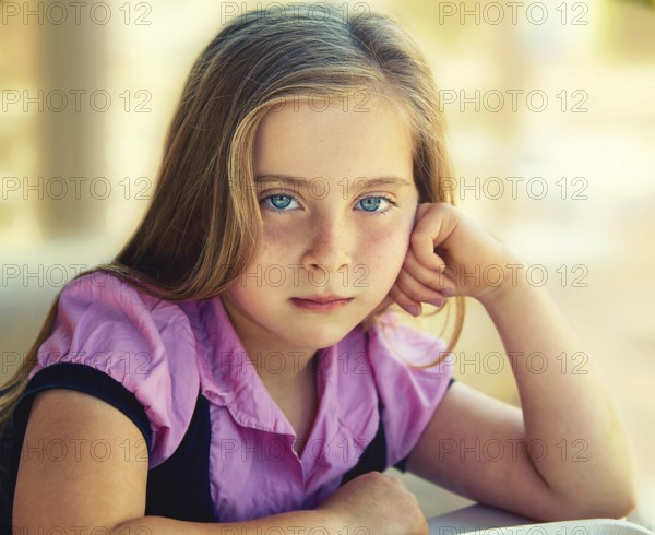 Blond relaxed sad kid girl expression blue eyes portrait
