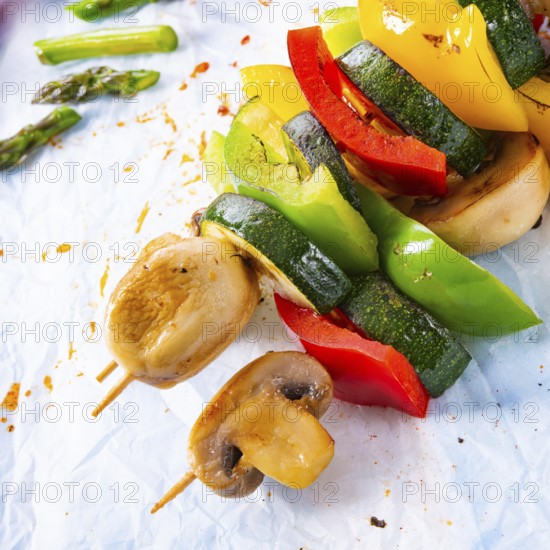 Vegetarian skewers white mushrooms, peppers and zucchini for barbecue