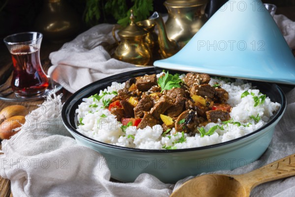 Tajin beef stew with rice, peppers and sesame seeds