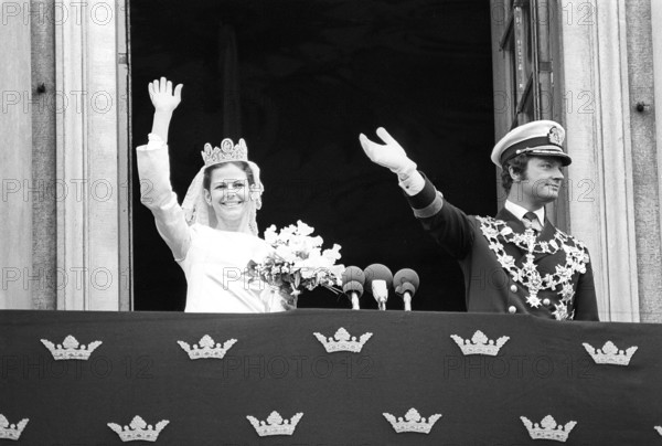 Wedding of Carl XVI Gustaf and Silvia Sommerlath. Carl XVI Gustaf, King of Sweden. Born 30 april 1946. The wedding 19 june 1976 in Stockholm. Queen Silvia in her wedding dress with king Carl XVI Gustaf on the balcony of the royal castle in Stockholm