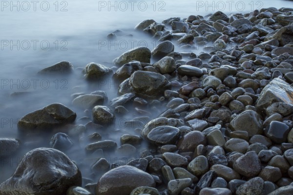 Time exposure of stones in the Westfjords coast, Iceland, Europe