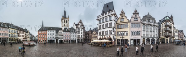 Trier, Rhineland-Palatinate, Germany, 04 15 2019, 180 degrees extra large panoramic view over the Hauptmark, the main market square in Trier with rainy weather, Europe
