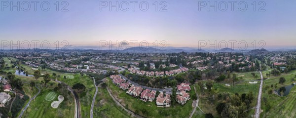 Aerial panoramic view of golf in upscale residential neighborhood during sunset, Rancho Bernardo, San Diego County, California. USA