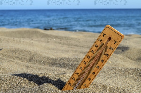 a Thermometer on the Sand Beach