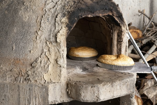 Fresh homemade bread cooked on a traditional clay oven. Home bakery