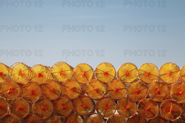Stacked orange fishing trap net at BaeksaJang port in Anmyeondo Island, Taean, Korea