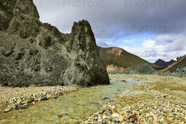 Green rock and creek in the gorge. National Park Landmannalaugar in Iceland