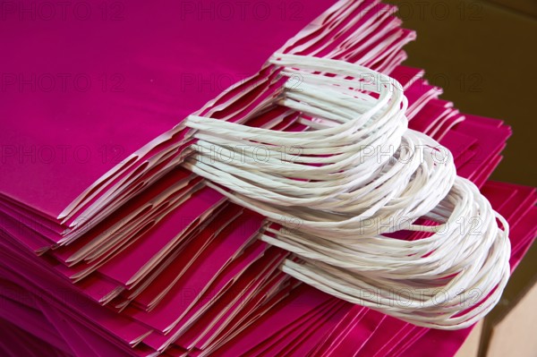 Paper bags atacked in a factory pink color bag