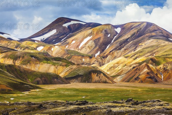 National Park Landmannalaugar. On the gentle slopes of the mountains are snow fields and glaciers. Magnificent Iceland in the July