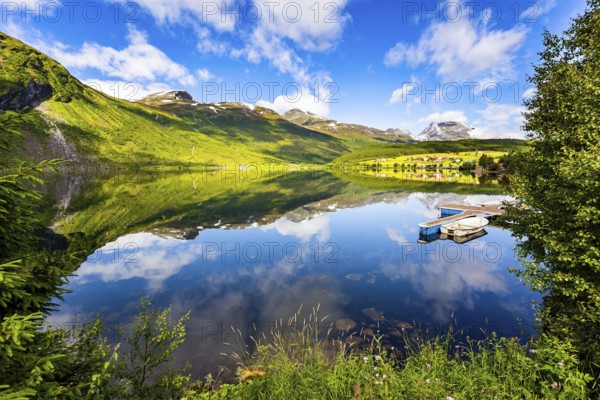 The lovely clean and calm lake Eidsvatnet. Warm sunny day in July. Summer trip to Norway. Northern Europe