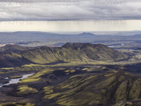 View from Mount Sveinstindur, volcanic landscape, moss-covered hills, mountains, Icelandic highlands, Iceland, Europe