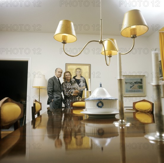Gullan Marianne, Princess Bernadotte, Countess of Wisborg (née Lindberg, later Tchang, born 15 July 1924), also known as Princess Marianne Bernadotte, is a Swedish actress, fashion icon and philanthropist who in 1961 married Sigvard Bernadotte, the second son of Gustaf VI Adolf of Sweden. Pictured: Marianne and Sigvard Berndotte 1974 where they stand in the large dining room. On the wall behind the Countess hangs the artist Zoia's painting of her. Kristoffersson