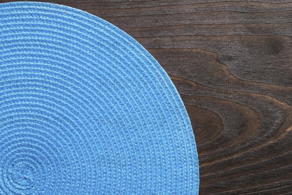 Wickered round mat on vintage wooden board