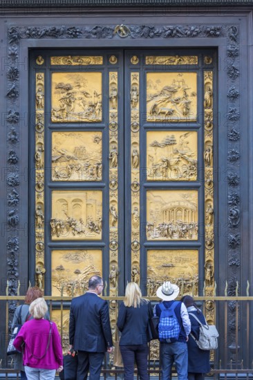 Tourists at the Gates of Paradise at the Baptistery of Saint John in Florence, Italy, Europe