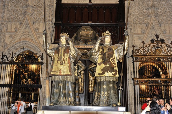 Sarcophagus of Christopher Columbus in the interior of the Cathedral of Santa María de la Sede in Seville, Andalusia, Two large statues with symbolic shields in a richly decorated Gothic church setting, Seville, Andalusia, Spain, Europe