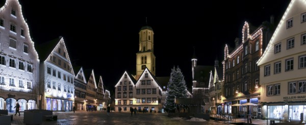 Panoramic night photo of the historic buildings around the market square with Christmas tree and Christmas lights and in the background the parish church of St Martin, Biberach an der Riß, Upper Swabia, Baden-Württemberg, Germany, Europe