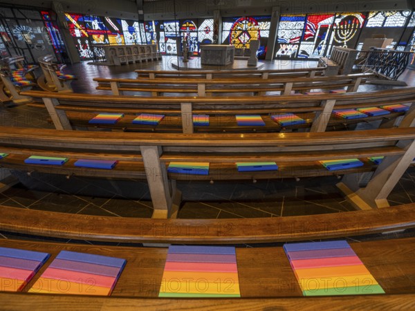 Catholic motorway church St. Christophorus on the A5 motorway near Baden Baden from 1978, interior, benches with rainbow-coloured seat cushions, Baden-Baden, Baden-Württemberg, Germany, Europe