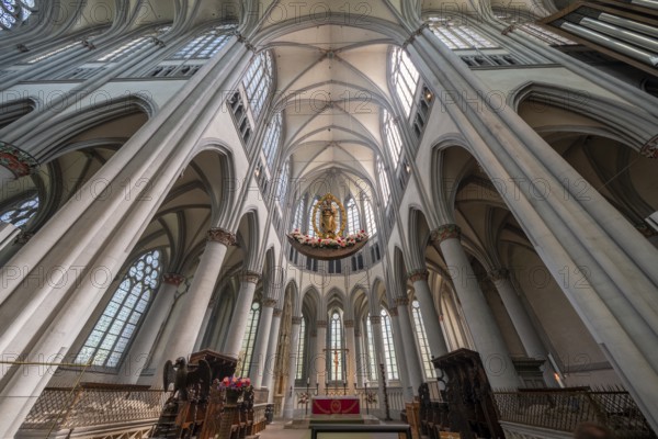 Altenberg Cathedral (also known as Bergischer Dom), interior view with grisaille windows in the choir apse, radiant-crowned Madonna (c. 1530) and eagle lectern, former monastery church of Altenberg Abbey, built by the Cistercians from 1133, since 1857 simultaneous church for the Protestant and Catholic churches, Odenthal, North Rhine-Westphalia, Germany, Europe