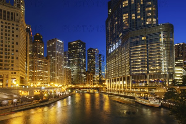 Chicago, USA, August 13th 2015: The night time view of Chicago River and surrounding buildings from the Wrigley Building and N Michigan Avenue, North America