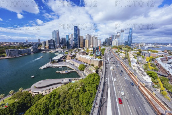 SYDNEY, AUSTRALIA, MARCH 4 2023: The Sydney CBD and surrounding harbour, including Circular Quay and The Rocks on a clear autumn day in Sydney, Australia, Oceania