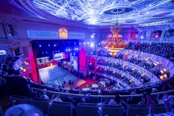The SemperOperaball 2025 celebrated its 100th anniversary on Friday. Germany's most beautiful classical entertainment event once again proved to be a complete success this year and offered a first-class programme created by top artists. In keeping with tradition, thousands of Dresdeners celebrated the event of the year outside on the theatre square at the Semper Opera Ball. Festively decorated ballroom, Dresden, Saxony, Germany, Europe