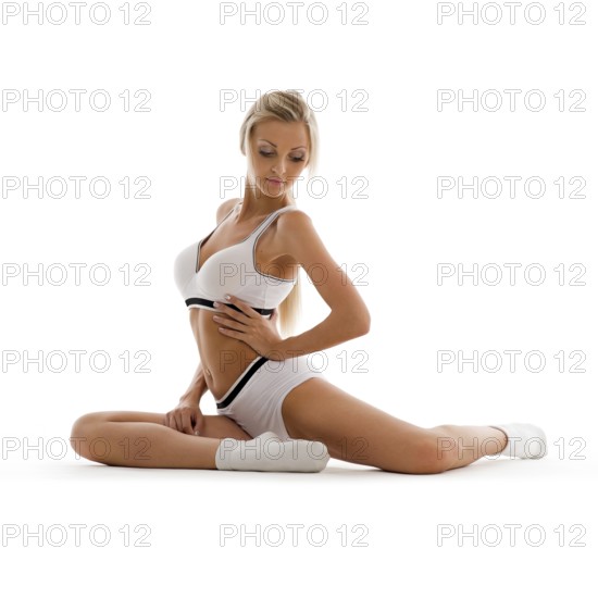 Beautiful blonde in sportswear doing exercises. Isolated picture, ST. Petersburg, Russia, Europe
