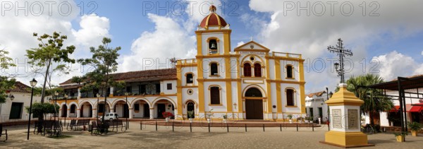 Typical street with white historic buildings in sun and shadow of Santa Cruz de Mompox, Colombia, World Heritage, South America