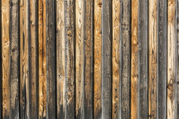 Background, rustic, weathered brown orange and black wooden wall