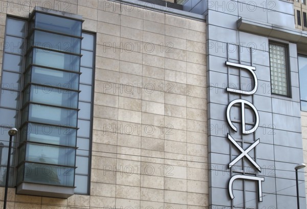 Manchester, united kingdom, 24 march 2022: sign on the front of the next clothing store in exchange square in manchester city centre