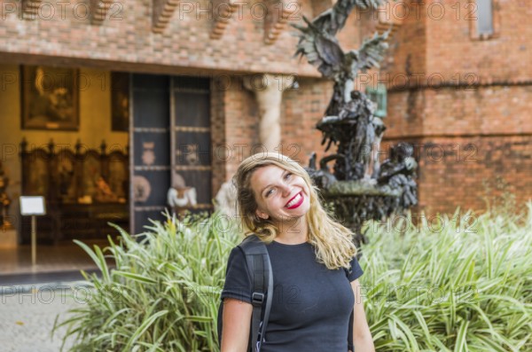 Young blonde tourist in front of Ricardo Brennand Institute in Recife, Brazil, South America