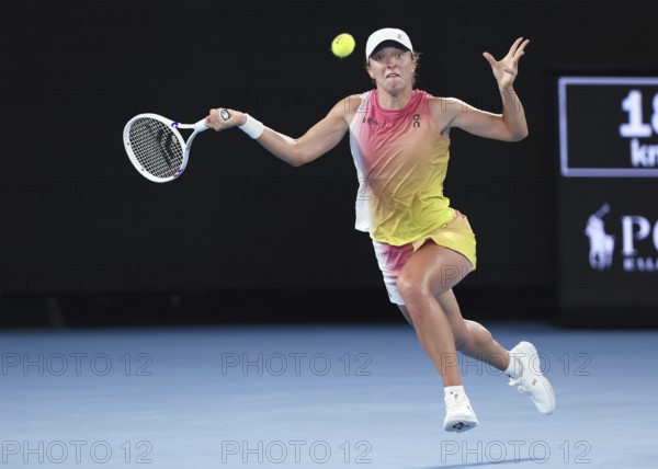 Polish tennis player Iga Swiatek playing a forehand shot at the Australian Open 2025 tournament, Melbourne Park, Melbourne, Victoria, Australia, Oceania