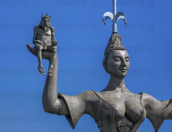 Royal figure on the right hand of Imperia, a rotating, nine-metre-high concrete statue in the port of Constance, designed by Peter Link. The statue is a satirical reminder of the Council of Constance (1414-1418), Constance, Baden-Württemberg, Germany, Europe