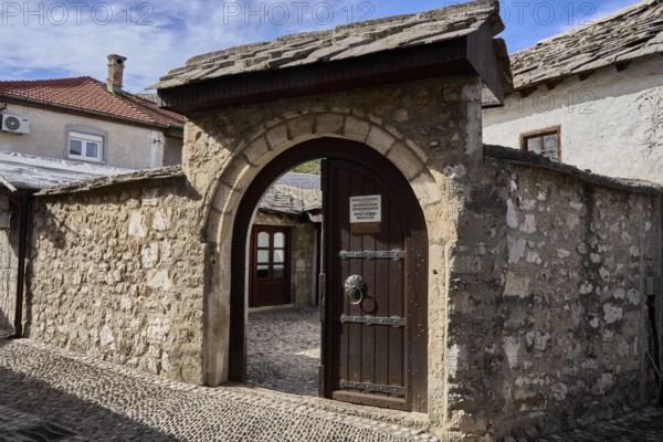 Tor tor to the courtyard of Biscevica Kuc, the Turkish house, historic Ottoman house and museum, Old Town of Mostar, Bosnia and Herzegovina, Europe