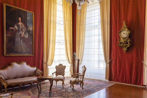 Venaria Reale, Italy, February 2023: luxury interior, old Royal Palace. Perspective with harp, window and baroque decoration, Europe