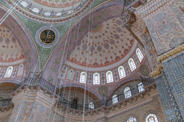 A picture of the colorful and gorgeous interior of the New Mosque, in Istanbul