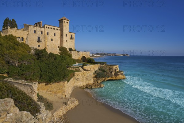 Cala La Jovera beach under Tamarit castle in Tarragona of Catalonia