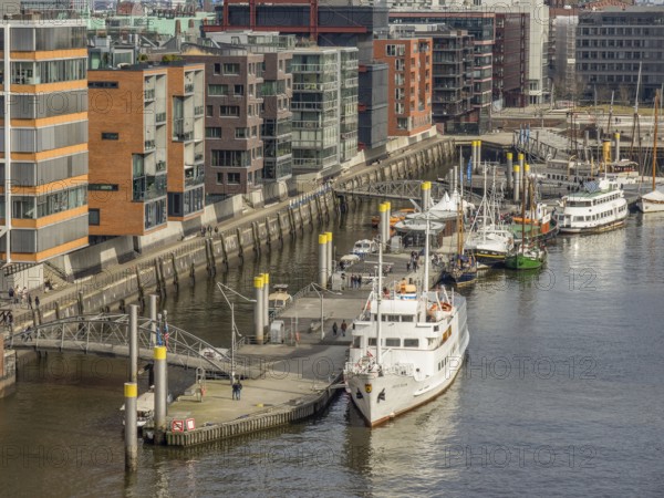 Harbour area with modern designed buildings along a canal. Boats and railings at the harbour, Hamburg, Germany, Europe