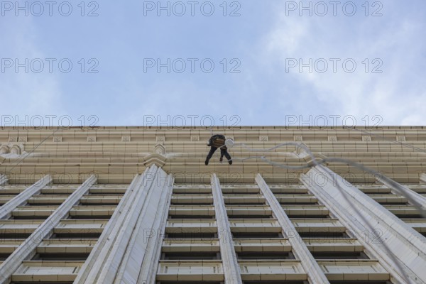Window cleaner on a historic building facade in Chicago, IL, USA, Chicago, United States, North America